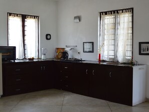 Fridge, microwave, cookware/dishes/utensils
