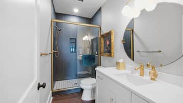 Shower, hair dryer, towels, shampoo