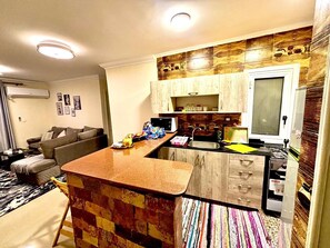 Fridge, microwave, oven, stovetop - Modern Luxury Retreat with Stunning Garden Views in B7 Heart of Madinaty Wifi/AC (Cairo Governorate)