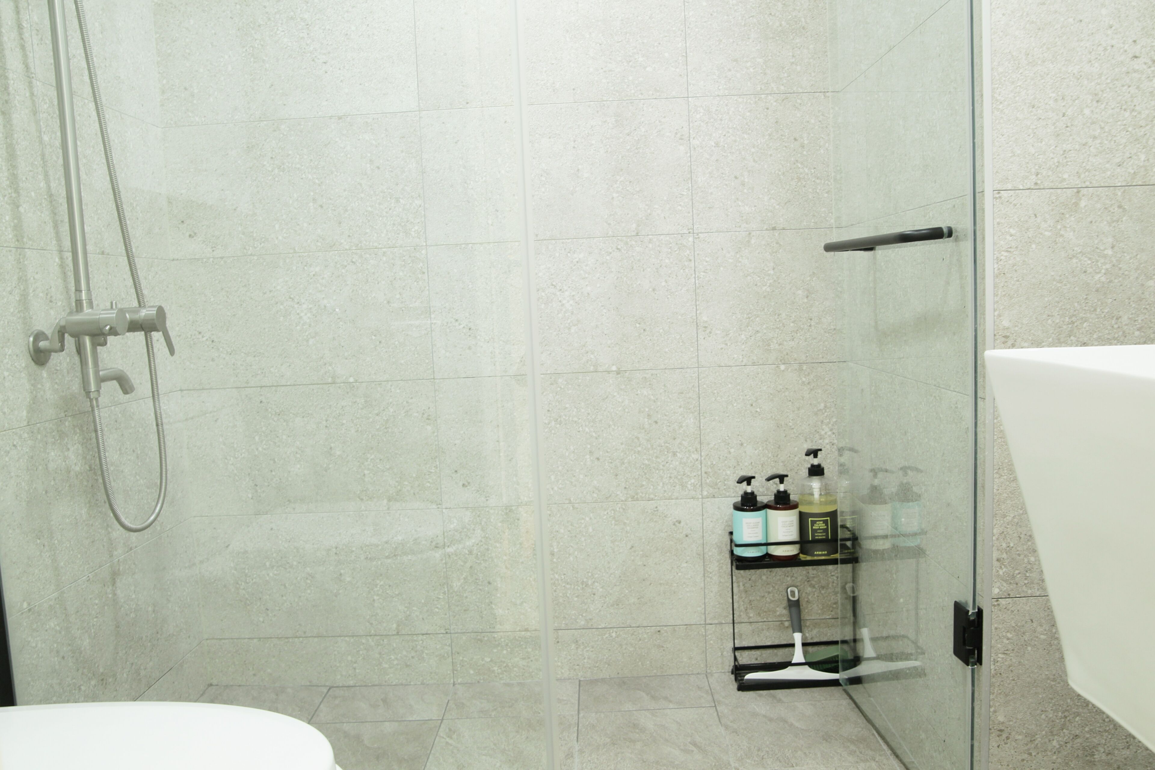 Shower, hair dryer, towels, shampoo