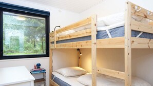 A bunk bed room with a desk and a window. - 6 Person Holiday Home in Ans By (Ans)