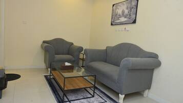 Junior Suite | Living area | 42-inch Smart TV with satellite channels