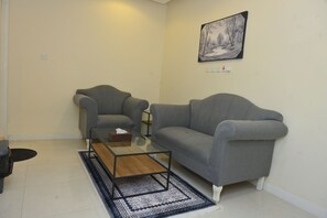 Junior Suite | Living area | 42-inch Smart TV with satellite channels - Roeya Vision Served Apartment (Riyadh)