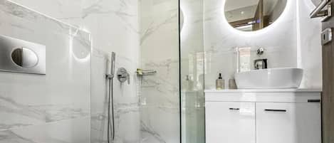 Shower, hair dryer, towels, soap