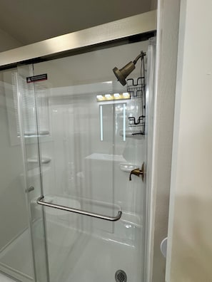 Shower, towels, soap, toilet paper