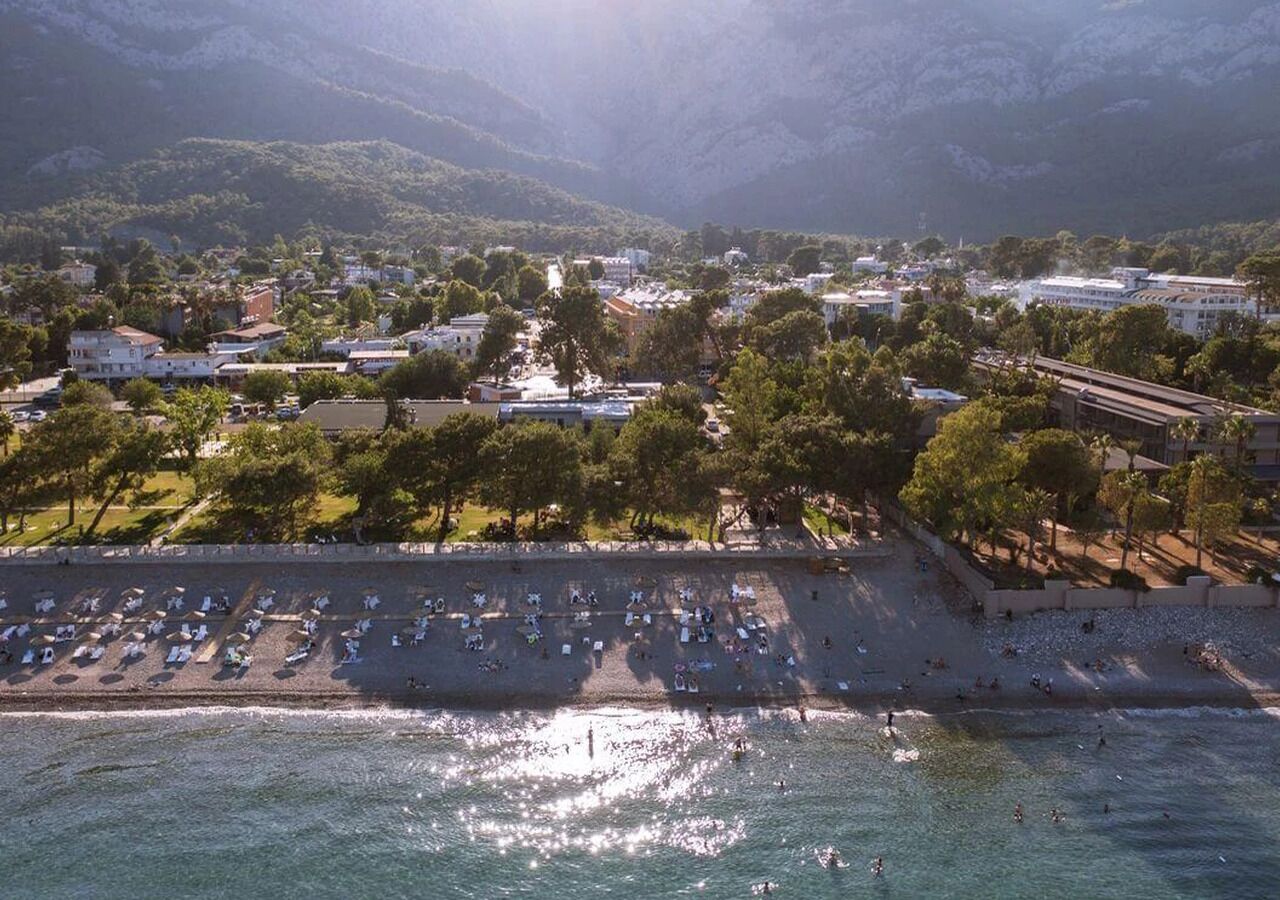 On the beach, sun loungers, beach umbrellas, beach towels