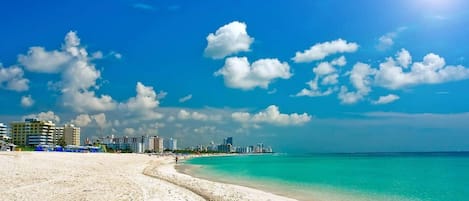 On the beach, sun loungers, beach towels