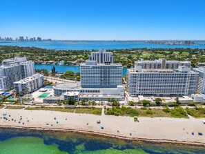 A coastal cityscape with high-rise hotels, a beach, and a marina. - 530 - Large Studio Ocean View (Miami Beach)