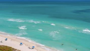 On the beach, sun-loungers, beach towels