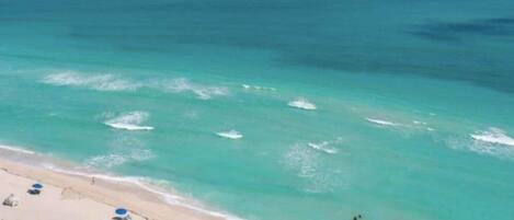 On the beach, sun loungers, beach towels