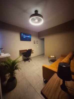 Suite – deluxe, flere senger, privat bad | Oppholdsområde
