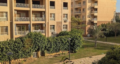 Madinaty Cozy 2BR narrow garden view apartment