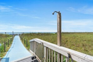 A wooden boardwalk leading to a beach with a clear sky. - Oceanfront Buena Vista 703- 2BR- Outdoor Pool (North Myrtle Beach)