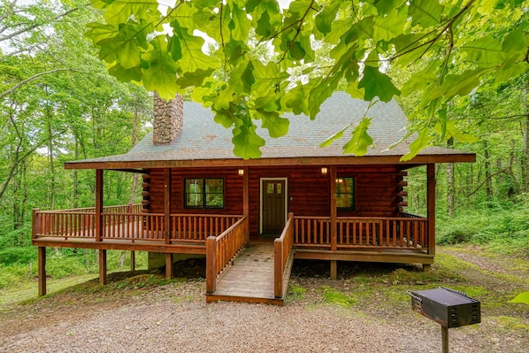 A cabin with a porch, a wooden deck, and a chimney. - Memory Ridge, Walk to Old Man (Logan)