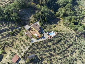 An aerial view of a property with a main house, a swimming pool, and a smaller building. - Villa Sandra Ortensia by Interhome (Casalguidi)