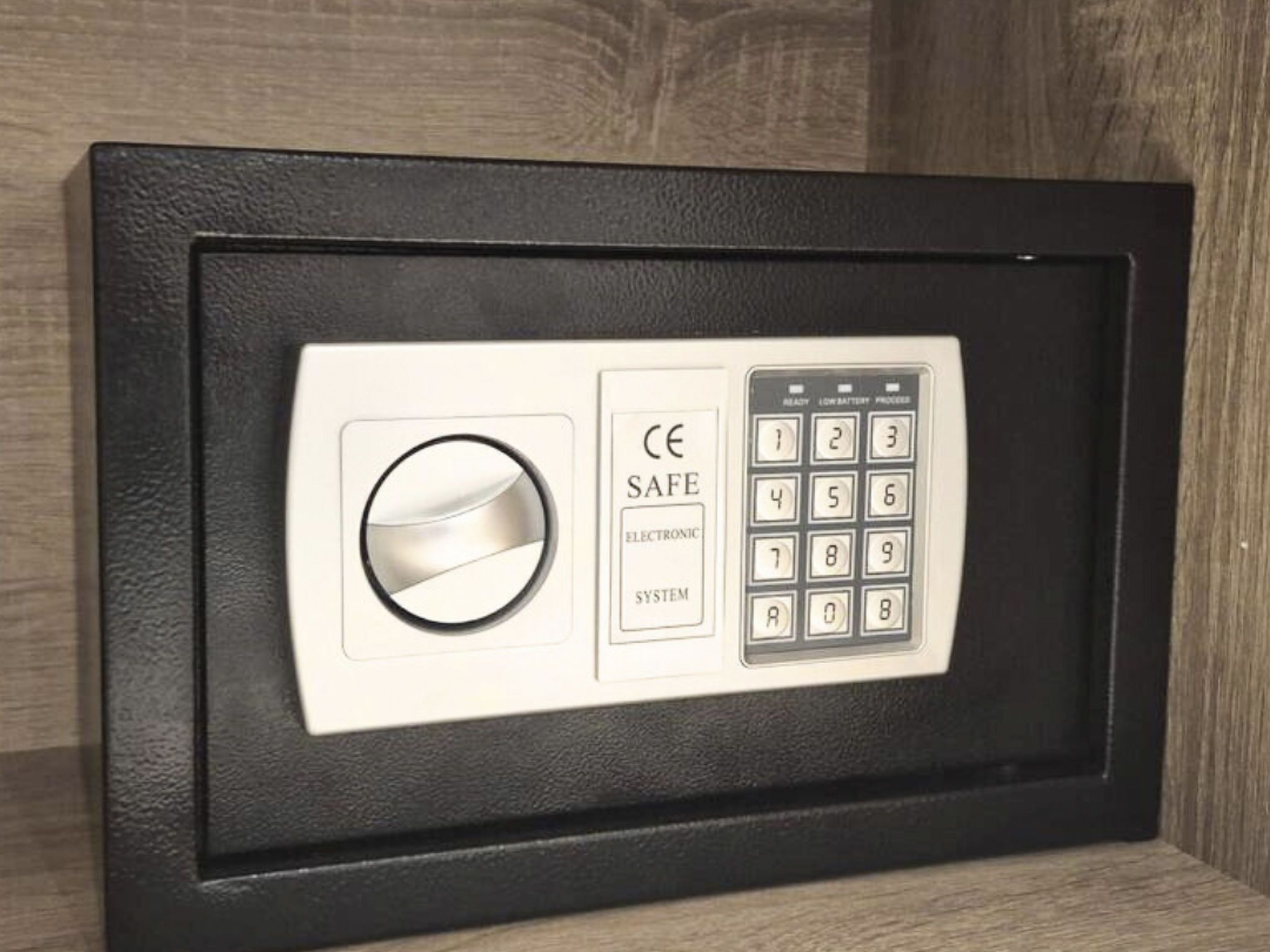A safe with a keypad and a circular lock mechanism.
