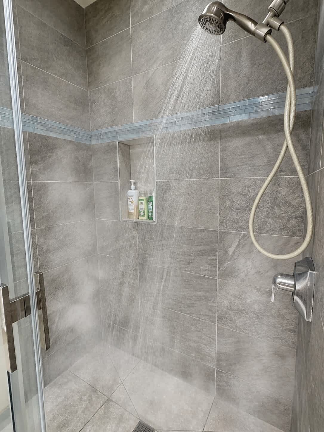 Shower, hair dryer, towels, shampoo