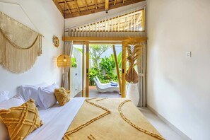 A room with a bed, a large window, a view of an outdoor area, and a ceiling fan. - Casa Viorica (Canggu)