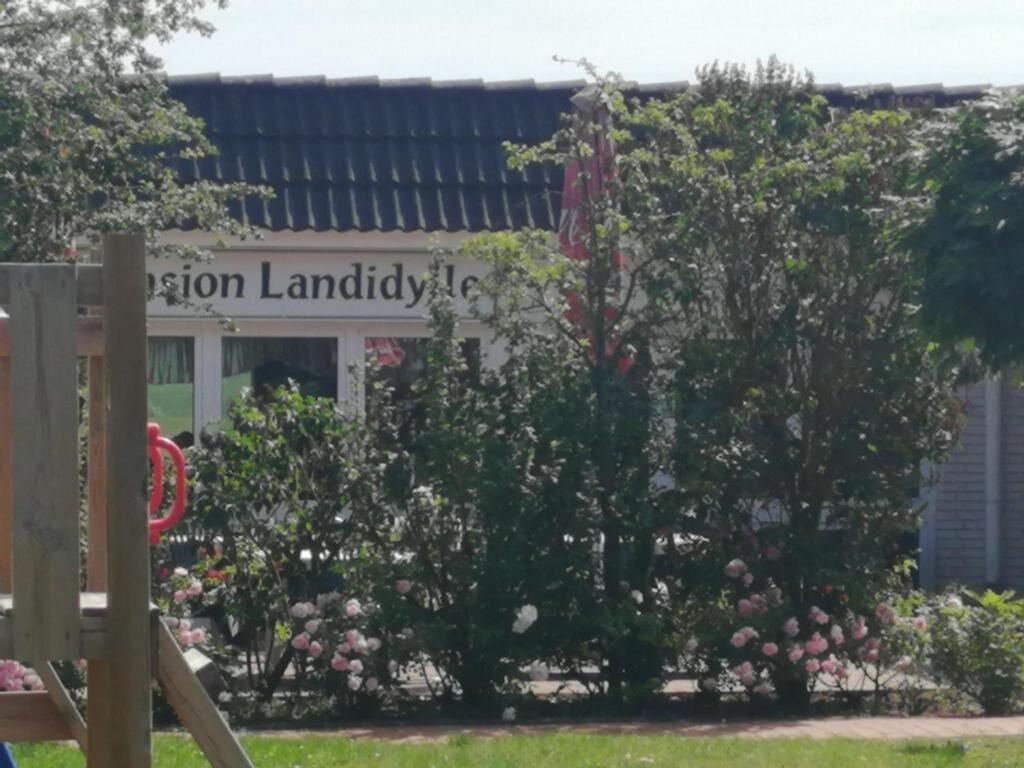 A building with a sign that reads 'Landon Landlady.'
