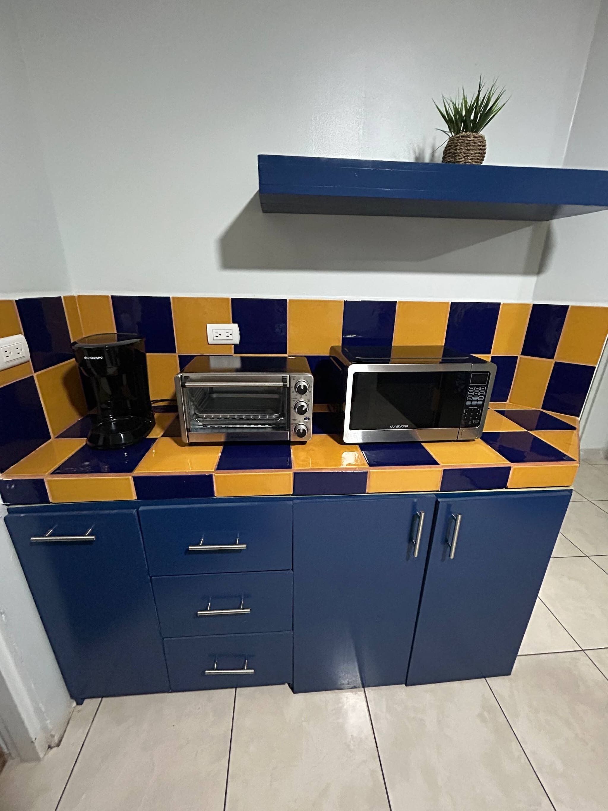 Fridge, microwave, stovetop, coffee/tea maker