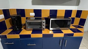 Fridge, microwave, stovetop, coffee/tea maker