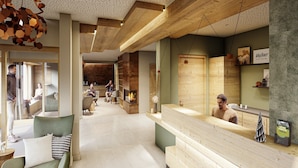 Un vestíbul d'hotel modern amb taulell de recepció, zona de seients i una llar de foc.