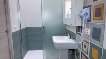Studio, Garden View | Bathroom | Shower, hair dryer, towels, soap