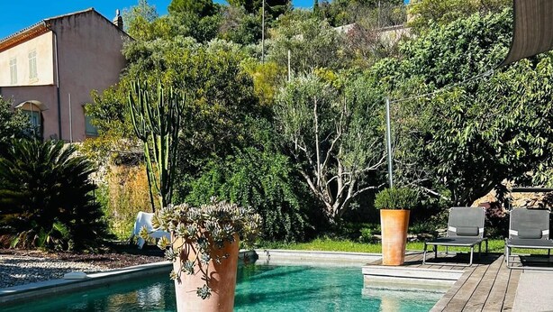 A wooden deck with a pool, potted plants, and outdoor seating. - Private villa with pool and garden (Ollioules)