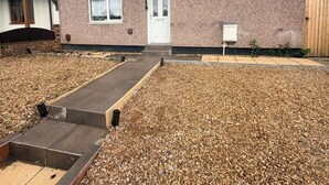 A two-story house with a front door, two windows, and a small porch. - House In Cannock-3 Bed Sleeps 5 (Cannock)