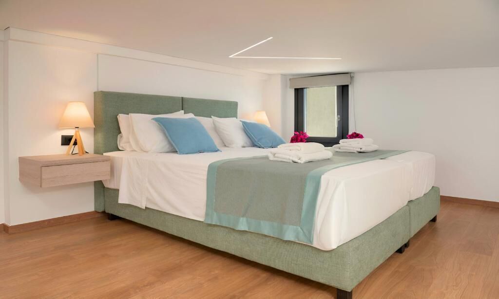 Suite, Balcony, Garden View | In-room safe, iron/ironing board, free WiFi
