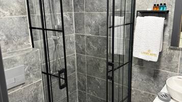 Shower, hair dryer, towels, soap
