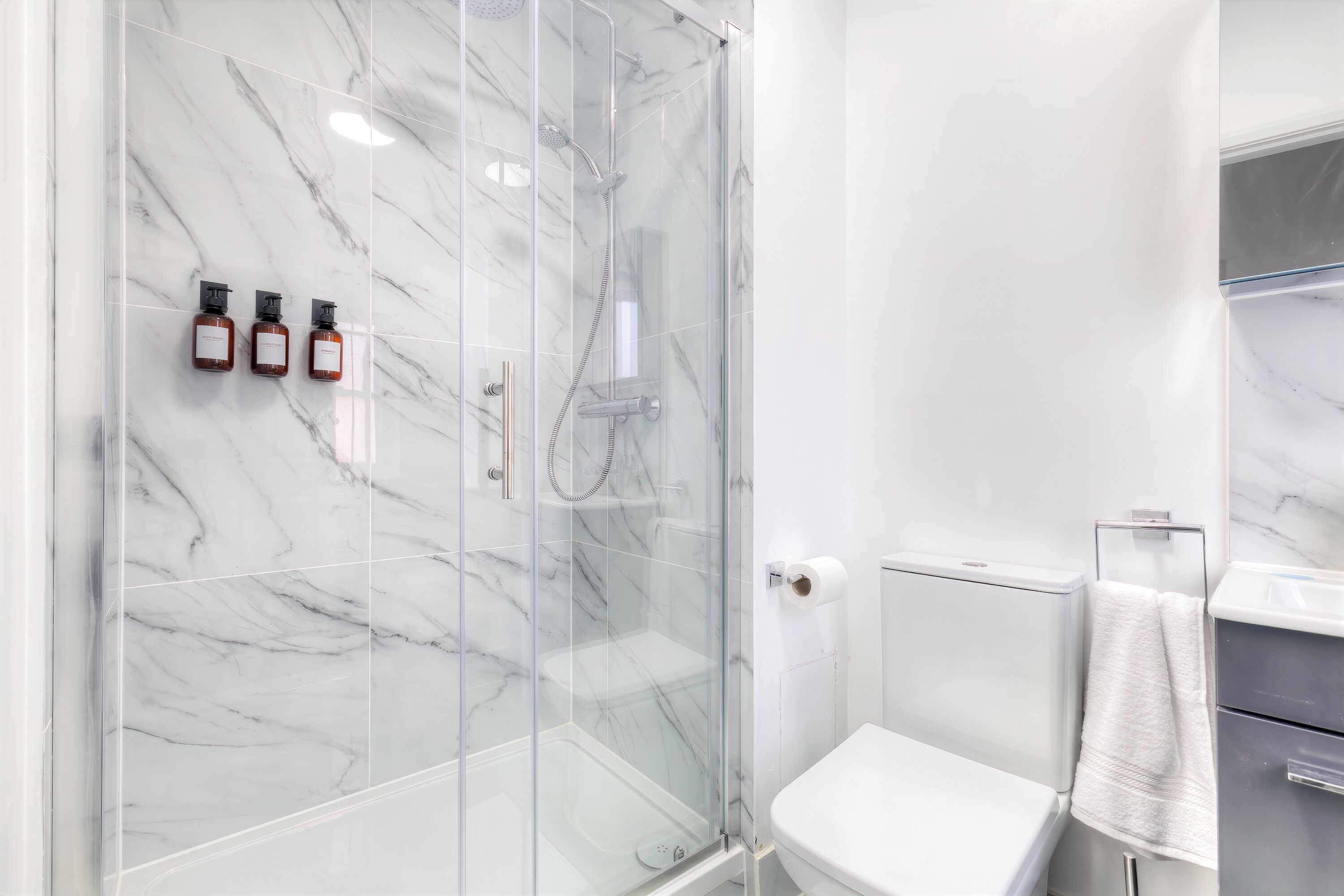Shower, hair dryer, towels, soap