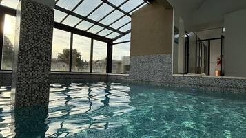 Indoor pool, outdoor pool, open noon to 8:00 PM, pool umbrellas
