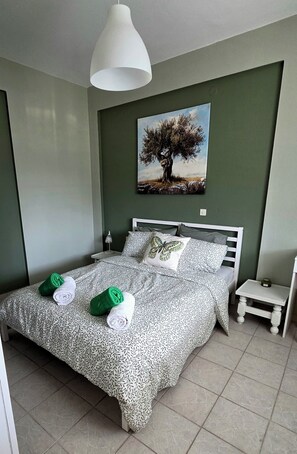 1 habitación, tabla de planchar con plancha, wifi gratis y ropa de cama 
