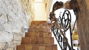 A staircase with stone walls and metal railings. - Stone House Only 150m From the sea (Umag)