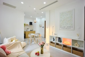 Appartement Deluxe, 1 grand lit et 1 canapé-lit, balcon | Coin séjour