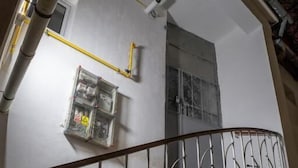 A staircase with metal railings, a utility box, and a window. - Barrique Eminescu 14 (Brașov)