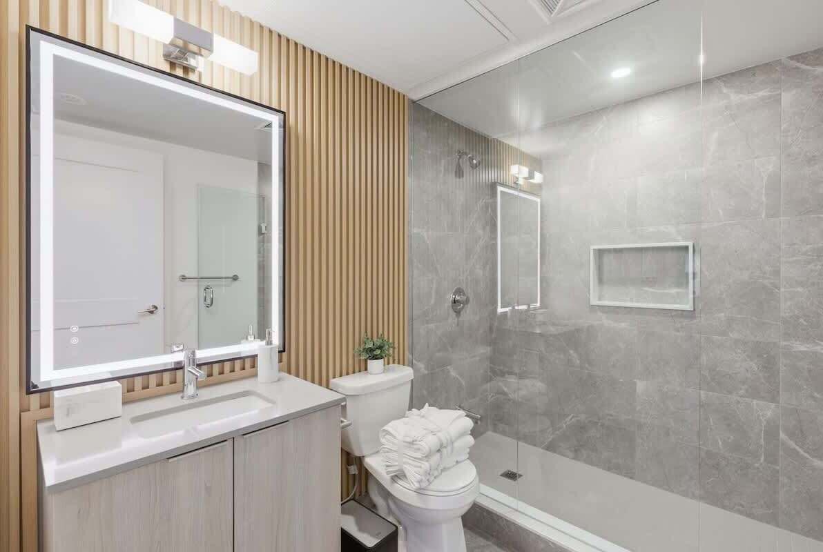 Shower, hair dryer, towels, shampoo