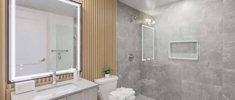 Shower, hair dryer, towels, shampoo