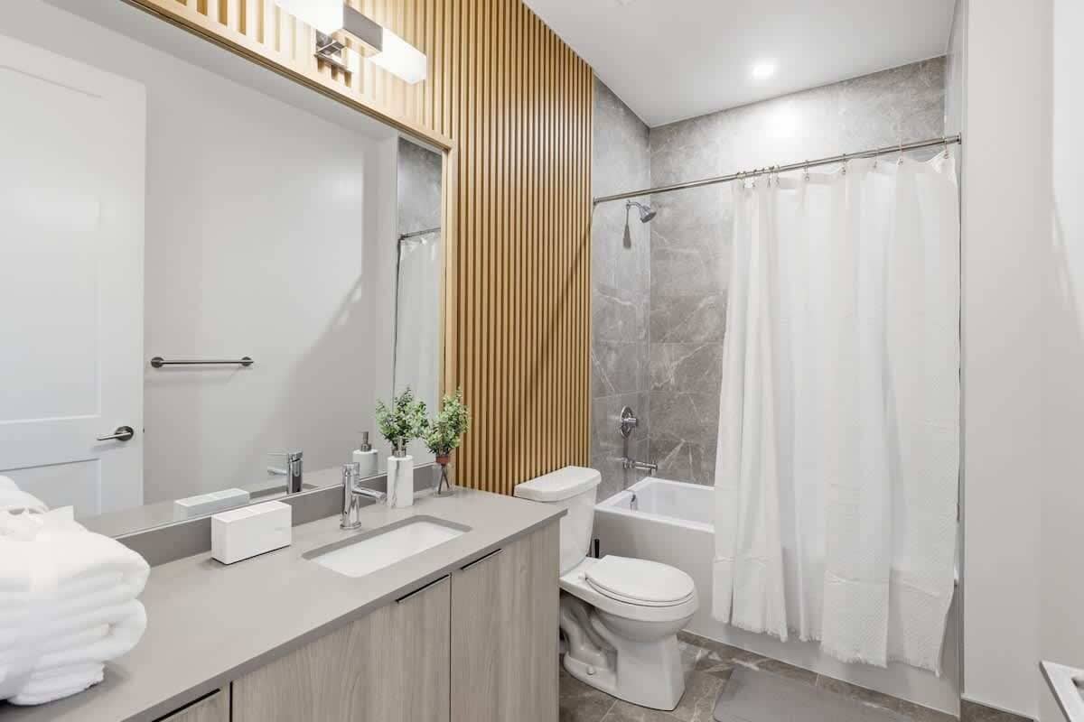 Shower, hair dryer, towels, shampoo