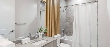 Shower, hair dryer, towels, shampoo