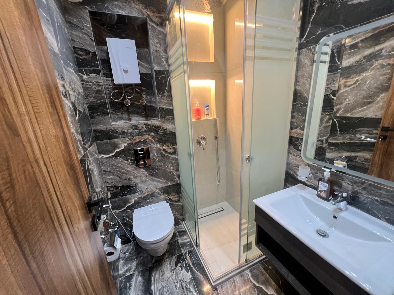 Shower, bidet, towels, soap