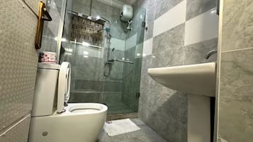 Shower, towels, soap, toilet paper