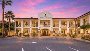 A multi-story hotel with a central entrance, balconies, and a sign reading 'Bella Notte'. - Bella Notte by the beach Studio 1 (Pleasure Point)