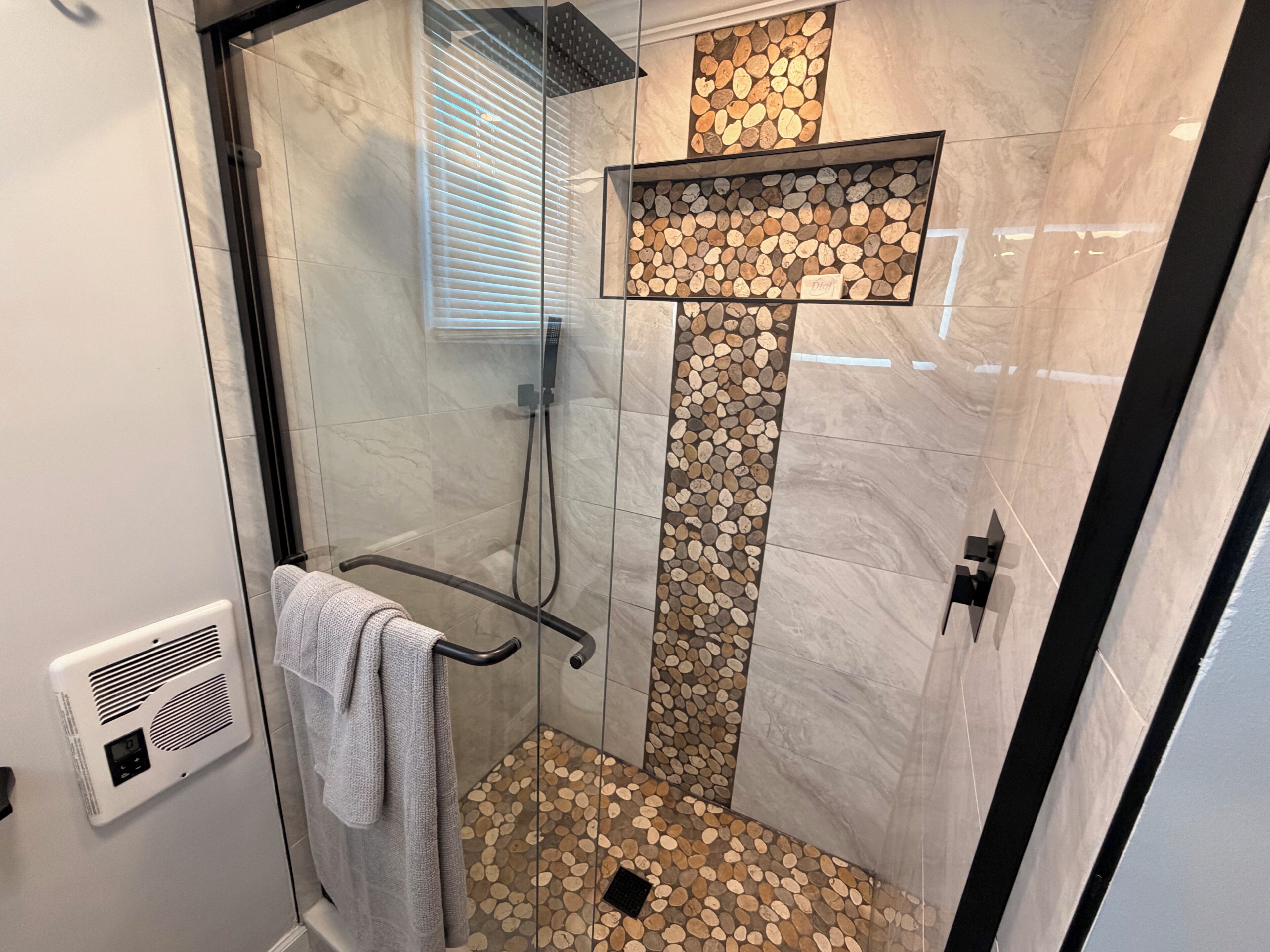 Shower, towels, soap, toilet paper
