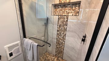 Shower, towels, soap, toilet paper
