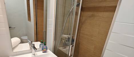 Shower, hair dryer, towels, soap