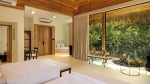 A modern hotel room with a large window, a bed, a desk, and a dining area.