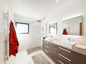Shower, hair dryer, towels, toilet paper