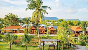 A resort with multiple bungalow-style buildings, a central water feature, and lush greenery. - Serene Resort in Bai Vong Phu Quoc (Phu Quoc)